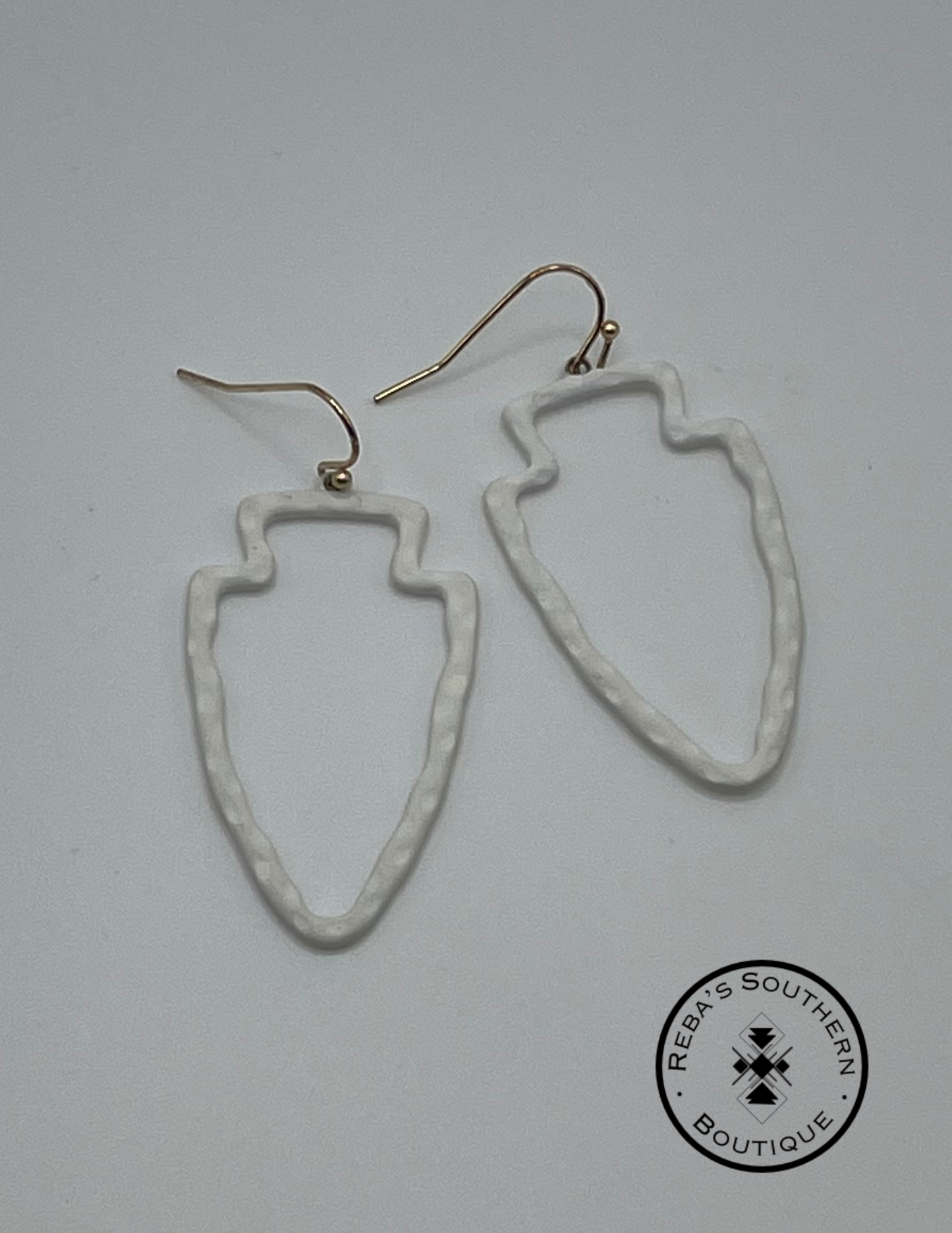 White arrowhead shaped fishhook earrings